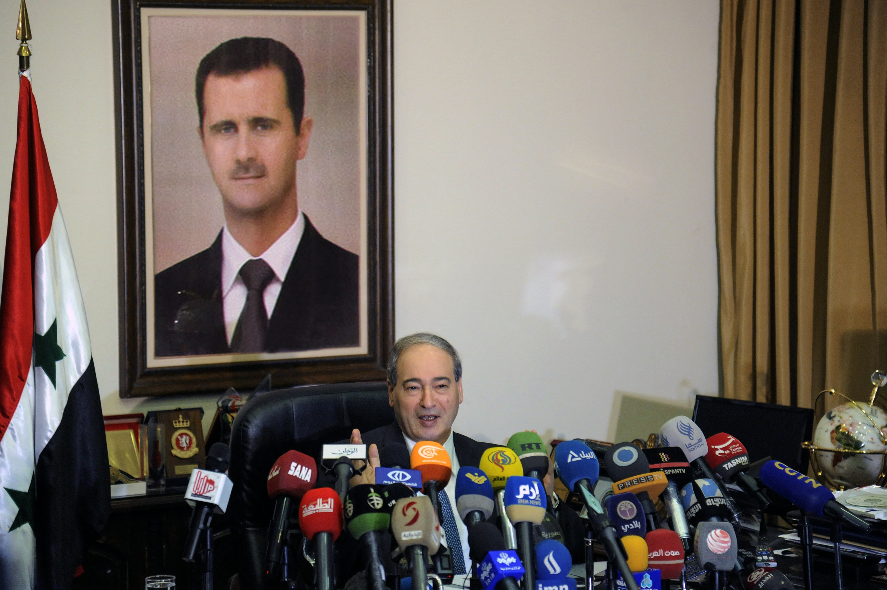 The Latest: Syria opposition urges force imposing cease-fire