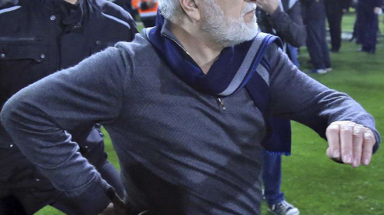 Greece's league suspended over gun incident