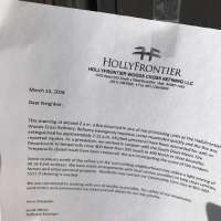 Refinery fire leaves film of oil on school, homes