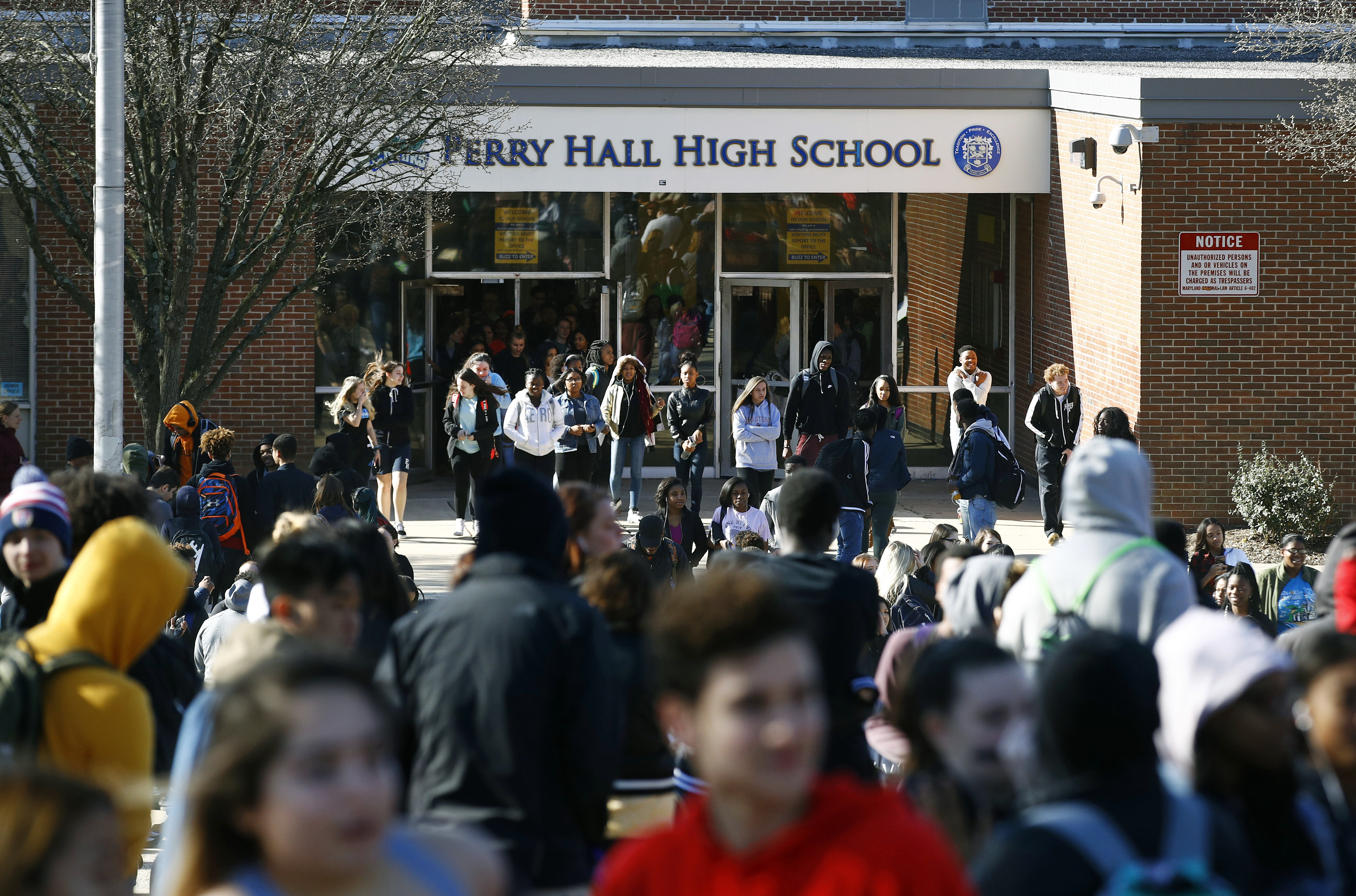 Students file out of Perry Hall High School in Perry Hall, Md., Wednesday, March 14, 2018, during a student walkout. Photo: AP Photo