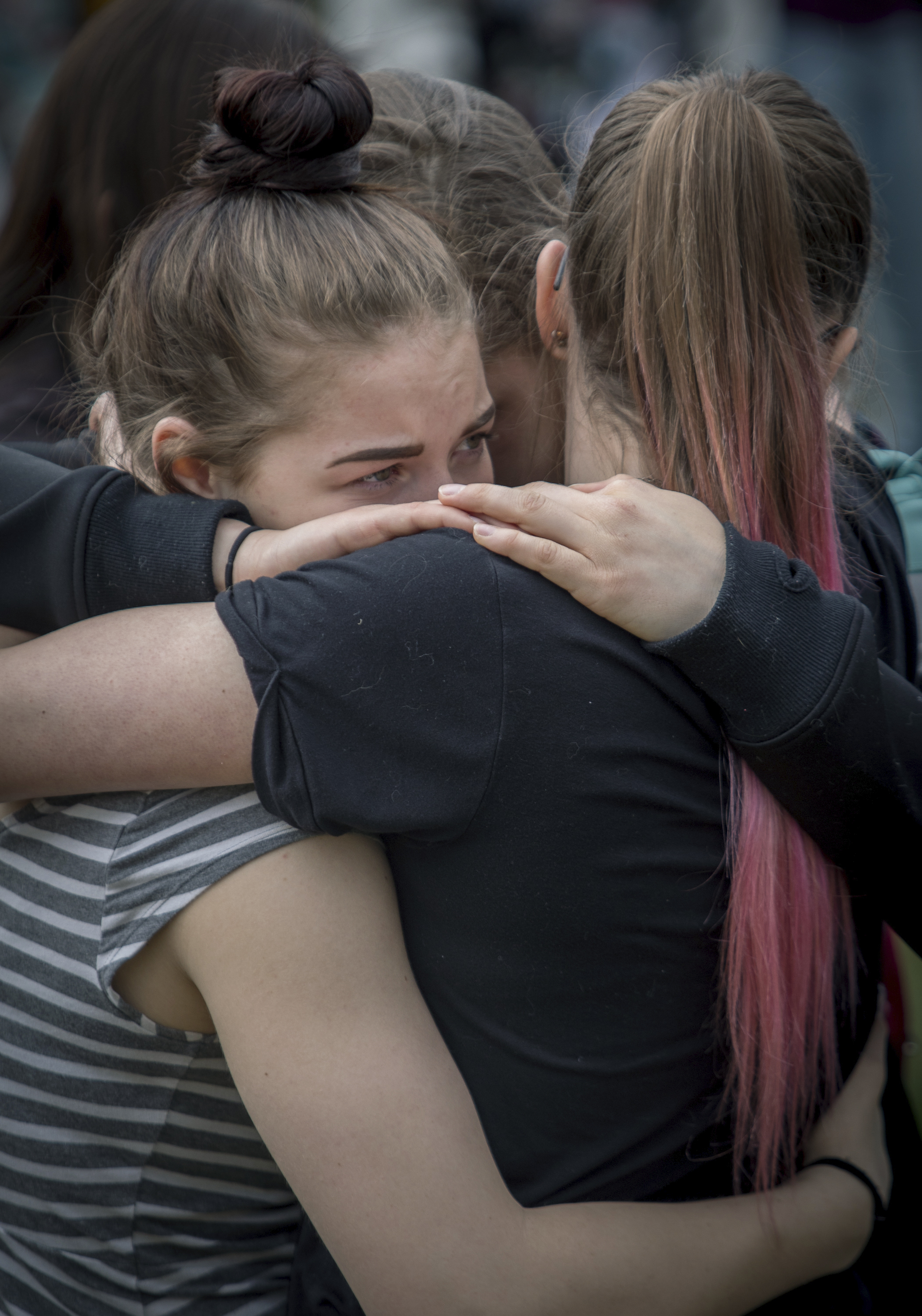 The Latest: School locks down after man spotted with rifle