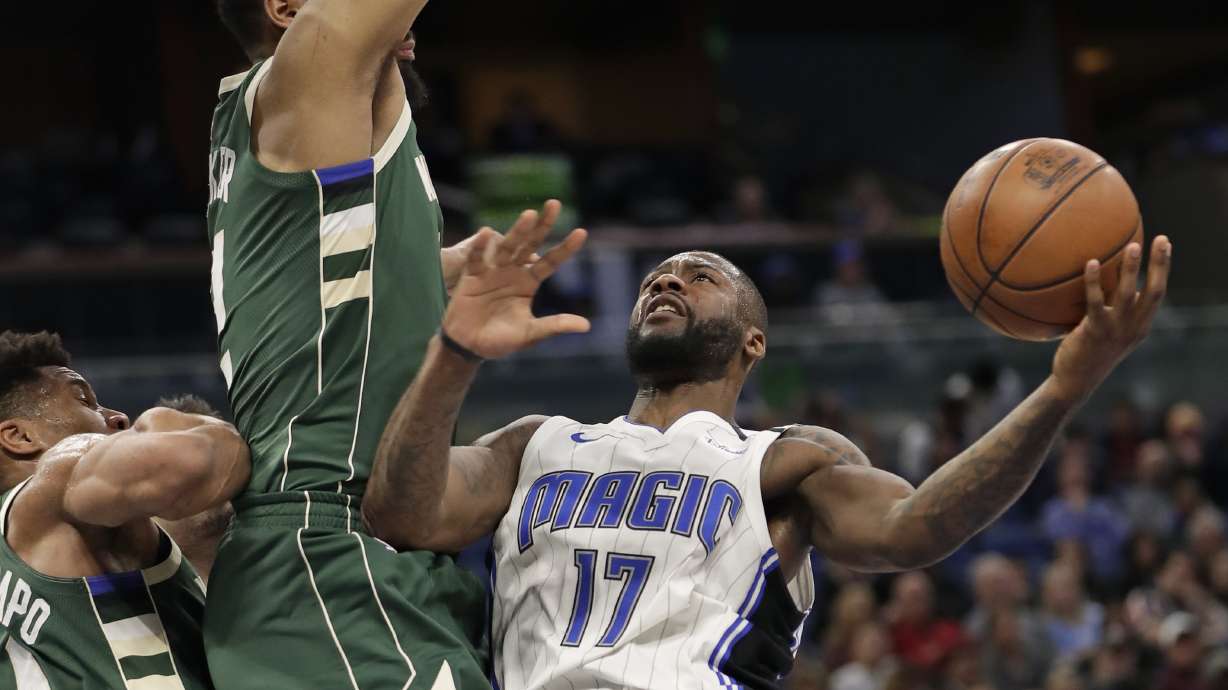 Simmons, Augustin power Magic over Bucks, 126-117
