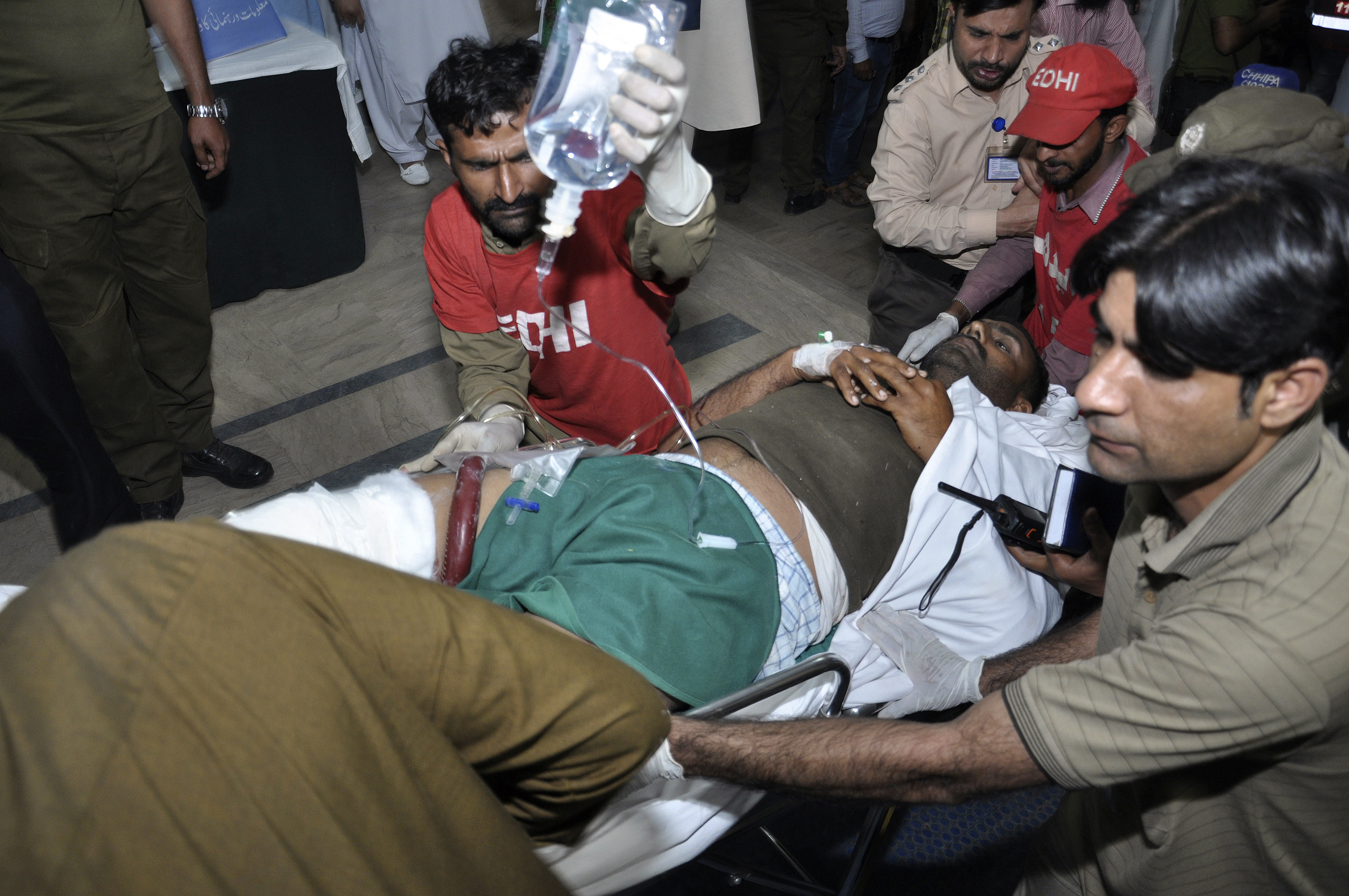Pakistanis attend funerals for 9 killed in suicide bombing