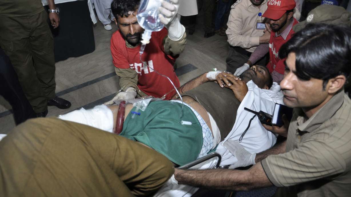 Pakistanis attend funerals for 9 killed in suicide bombing