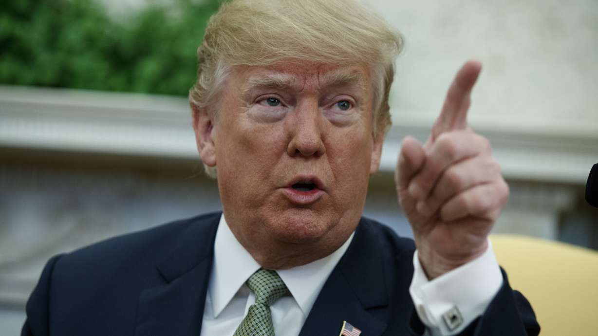 The Latest: Sanders defends Trump's Canada trade talk