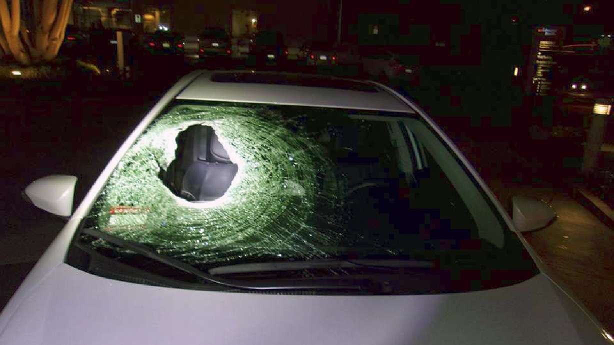 Boulder pushed off California overpass kills car passenger