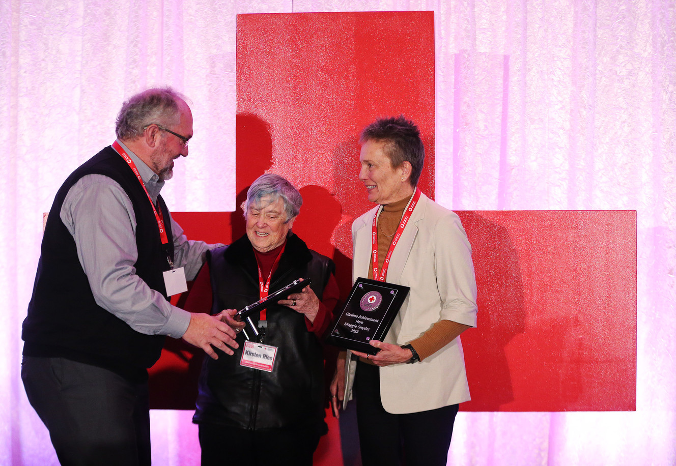 Dr. Kristen Ries, center and Maggie Snyder, right, receive the lifetime achievement award from Stan Penfold as the American Red Cross honors everyday heroes during Red Cross month. Photo: Jeffrey D. Allred, KSL