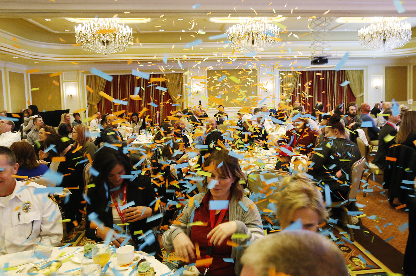 Jazz Bear fires a confetti cannon as the American Red Cross honors everyday heroes during Red Cross month in Salt Lake City on Friday, March 16, 2018. Photo: Jeffrey D. Allred, KSL