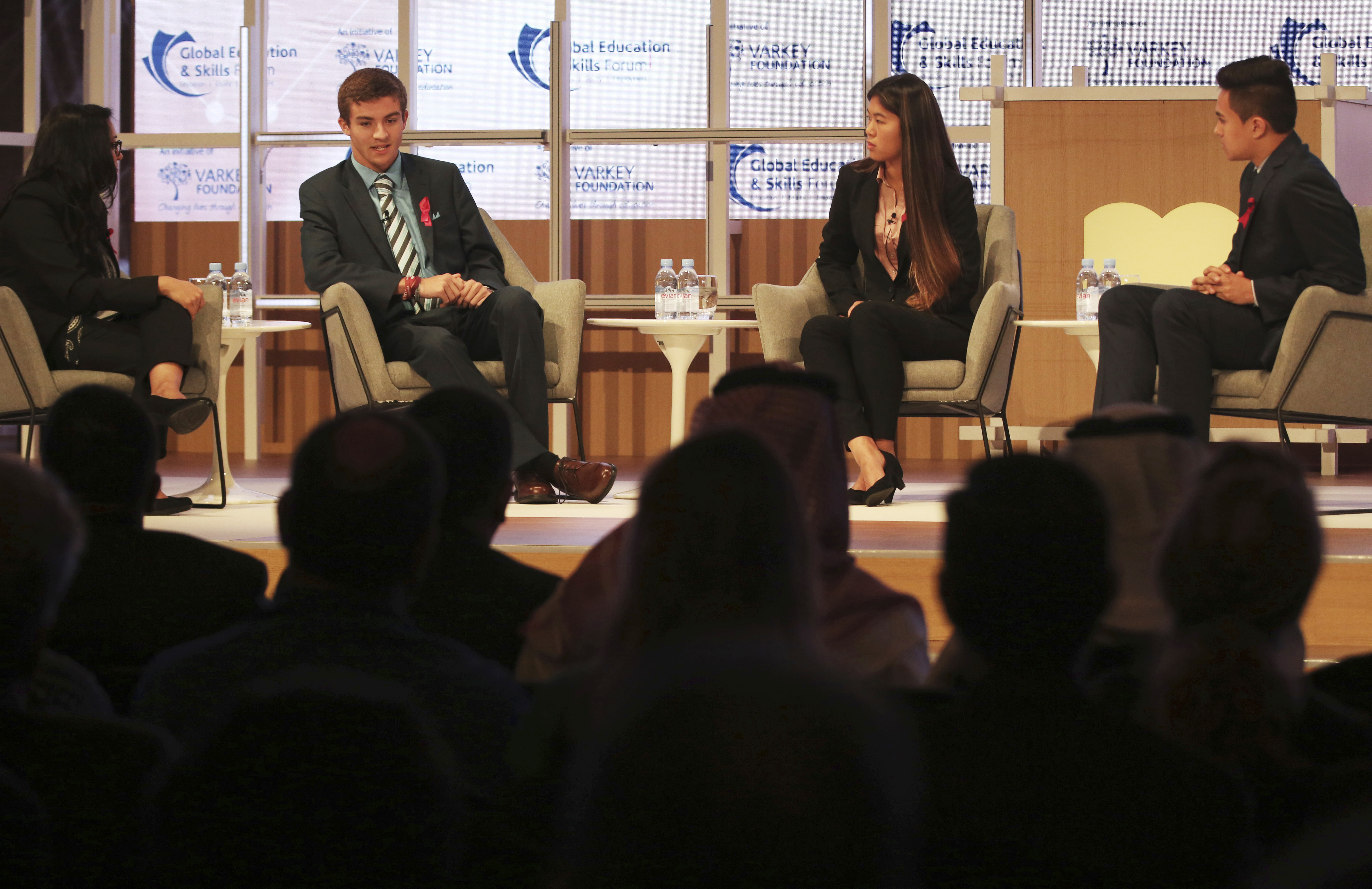 Moderator Vijita Patel, left, Parkland High School students Lewis Mizen, second left, Suzanna Barna, third left, and Kevin Trejos, right, hold a discussion on stage at the Global Education and Skills Forum in Dubai, United Arab Emirates, Saturday, March 17, 2018. Student survivors of a Florida high school shooting took their message calling for greater gun safety measures abroad for the first time on Saturday, sharing with educational professionals from around the world their frightening experience. (AP Photo/Jon Gambrell)