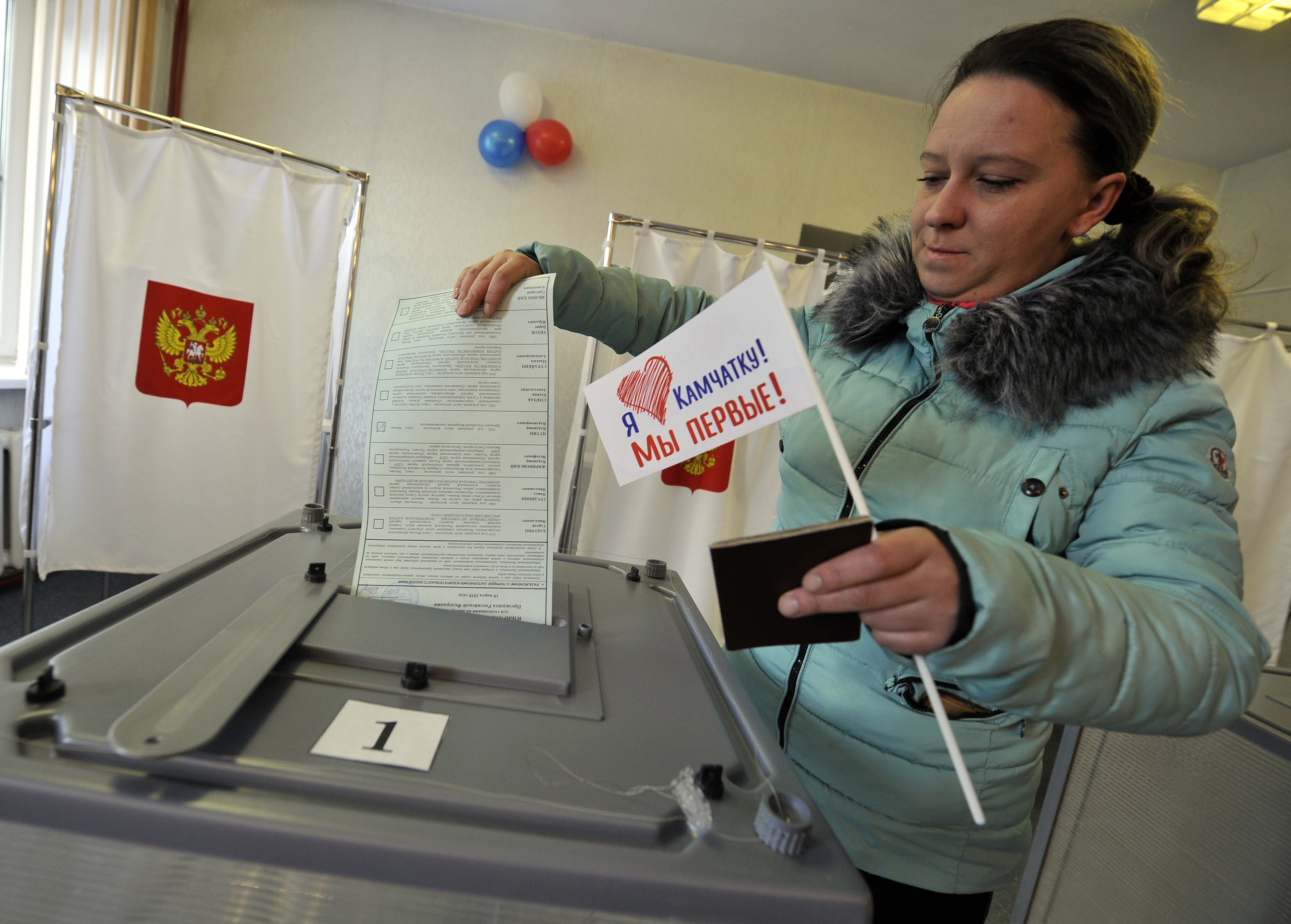 The Latest: Putin dodges question about future elections