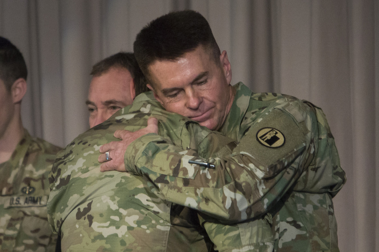 Sgt. 1st Class Madsen receives a hug from Maj. Gen. Jeff Burton, adjutant general of the Utah National Guard, after Madsen was presented with the Silver Star during a ceremony at Utah National Guard Headquarters in Draper on Sunday, March 18, 2018. At the ceremony, members of the Bravo Company, 1st Battalion, 19th Special Forces Group were awarded various medals for their service, including four Silver Stars. For reasons regarding the safety of award recipients, the media was asked to not directly show the recipients' faces and to only use their ranks and last names for identification. (Photo: Jacob Wiegand, KSL)