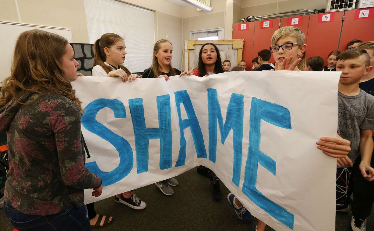 Daybreak Elementary School student hold a "shame" banner during a music video project at the school in South Jordan on Wednesday, March 21, 2018. The students broke through the sign to eliminate shame in their lives. The school in won a national award for kindness. (Photo: Jeffrey D. Allred, KSL)