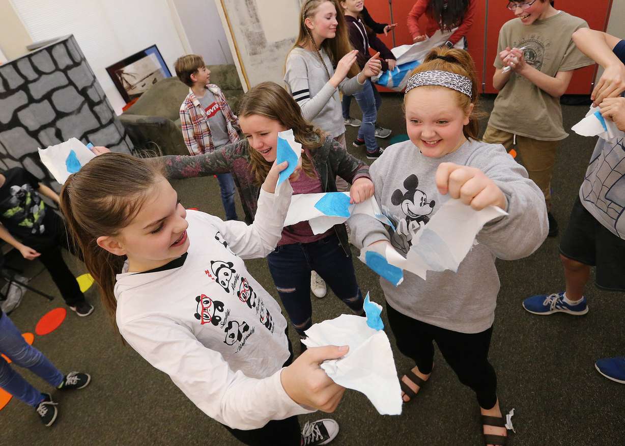 Daybreak Elementary School students Emily Anderson, Eloise Piercy and Brynlee Hutchings tear apart a banner while filming a music video project at the school in South Jordan on Wednesday, March 21, 2018. The school in won a national award for kindness. (Photo: Jeffrey D. Allred, KSL)