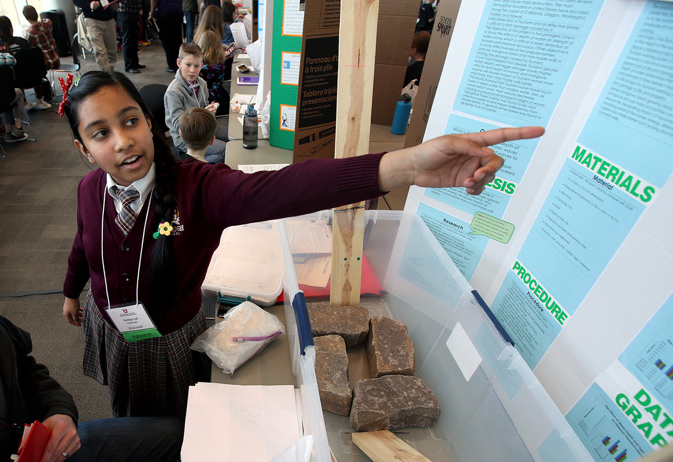 Aadya Lal explains her tsunami simulation experiment to a judge at the University of Utah Science and Engineering Fair. Photo: Kristin Murphy, KSL