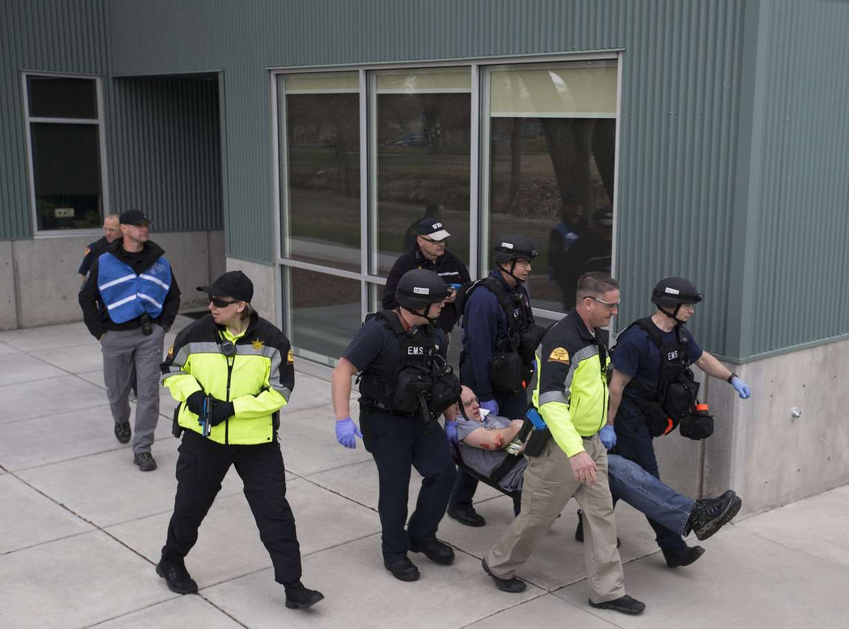 Officers with multiple law enforcement agencies participate in a public safety drill at Salt Lake Community College’s Taylorsville Redwood Campus in Salt Lake City on Thursday, March 22, 2018. (Photo: Laura Seitz, KSL)
