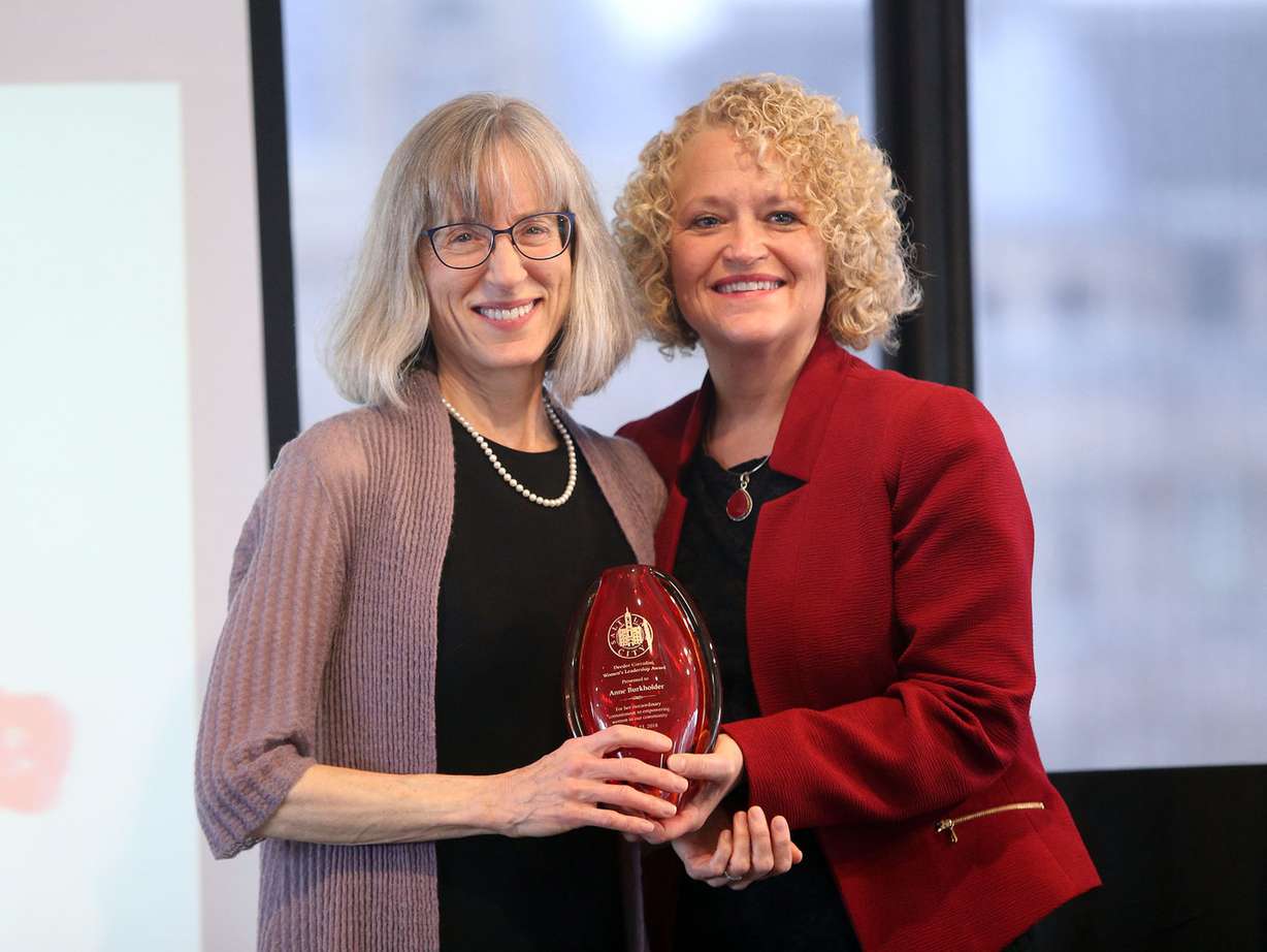 Anne Burkholder, CEO of YWCA Utah, is congratulated at the Deedee Corradini Women’s Leadership Luncheon and Awards Ceremony. Photo: Kristin Murphy, KSL