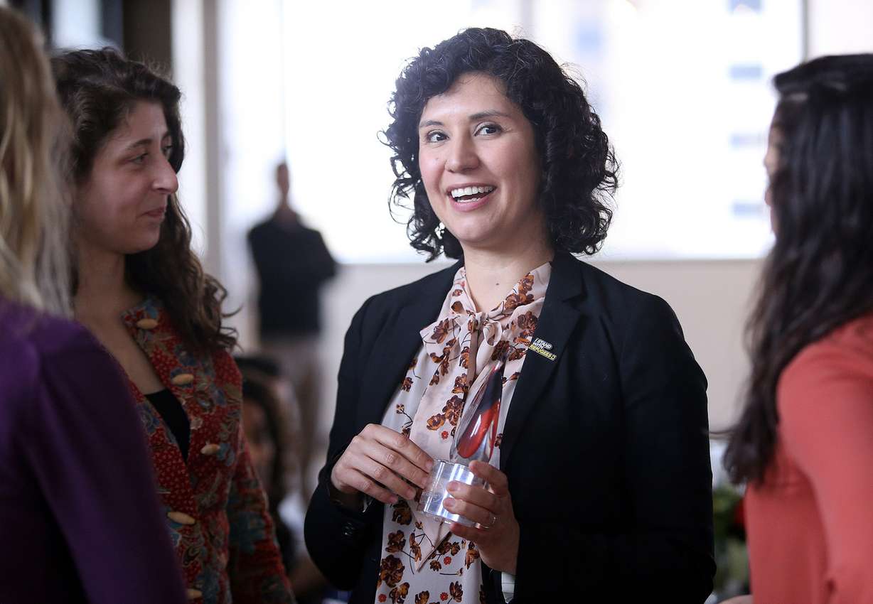 Natalie El-Deiry, co-founder of the Spice Kitchen Incubator and deputy director of development and strategic initiatives at the International Rescue Committee, accepts the Opportunity Builder Award for the Spice Kitchen at the Deedee Corradini Women’s Leadership Luncheon and Awards Ceremony. Photo: Kristin Murphy, KSL