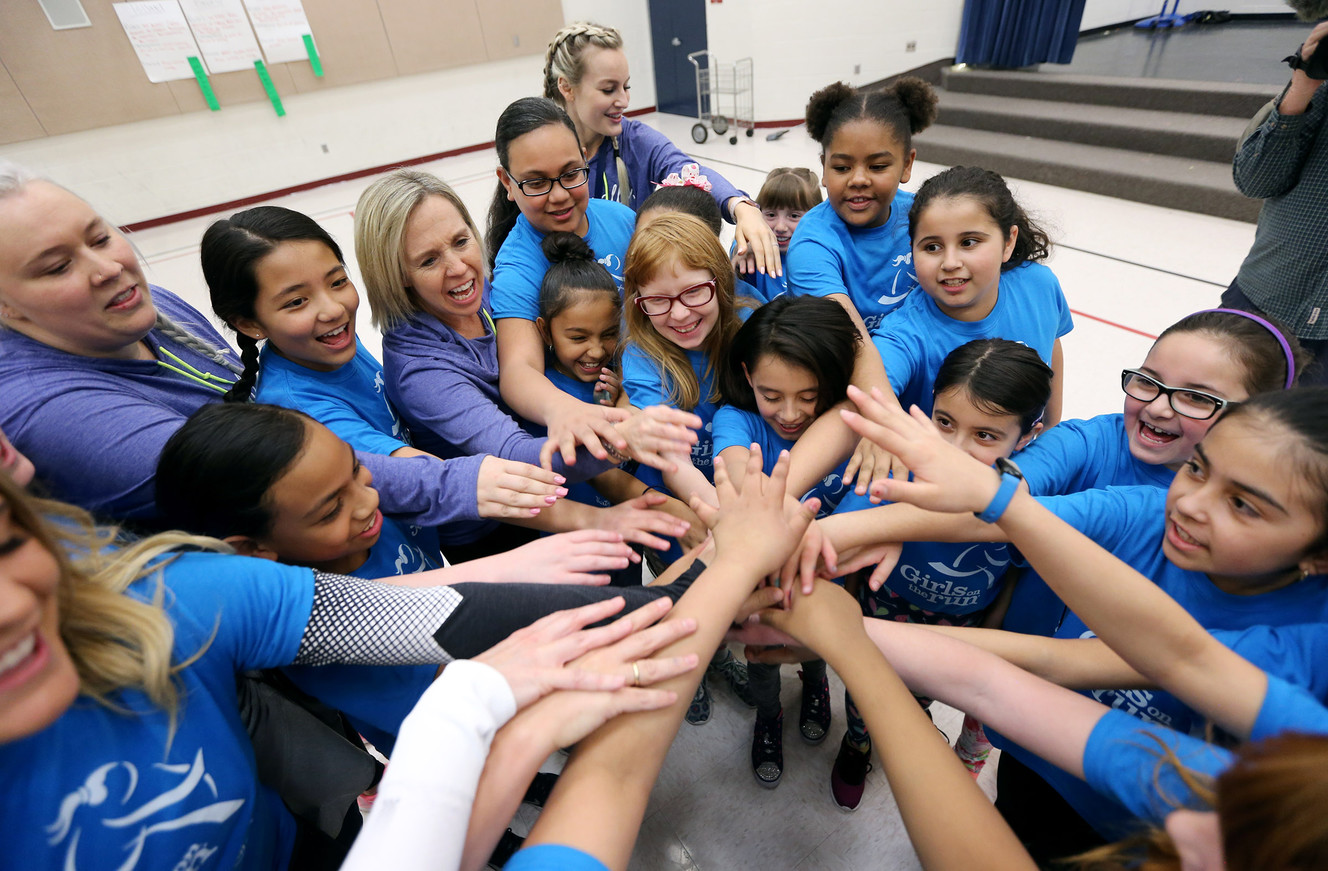 Students at Escalante Elementary School in North Salt Lake gather for a cheer after receiving new running shoes on Friday, March 23, 2018. The shoes were donated to the students by Girls on the Run, a nonprofit after-school character development program, and ASICS, a sports equipment company. More than 700 free pairs of running shoes will be given to local girls. (Photo: Scott G Winterton, KSL)