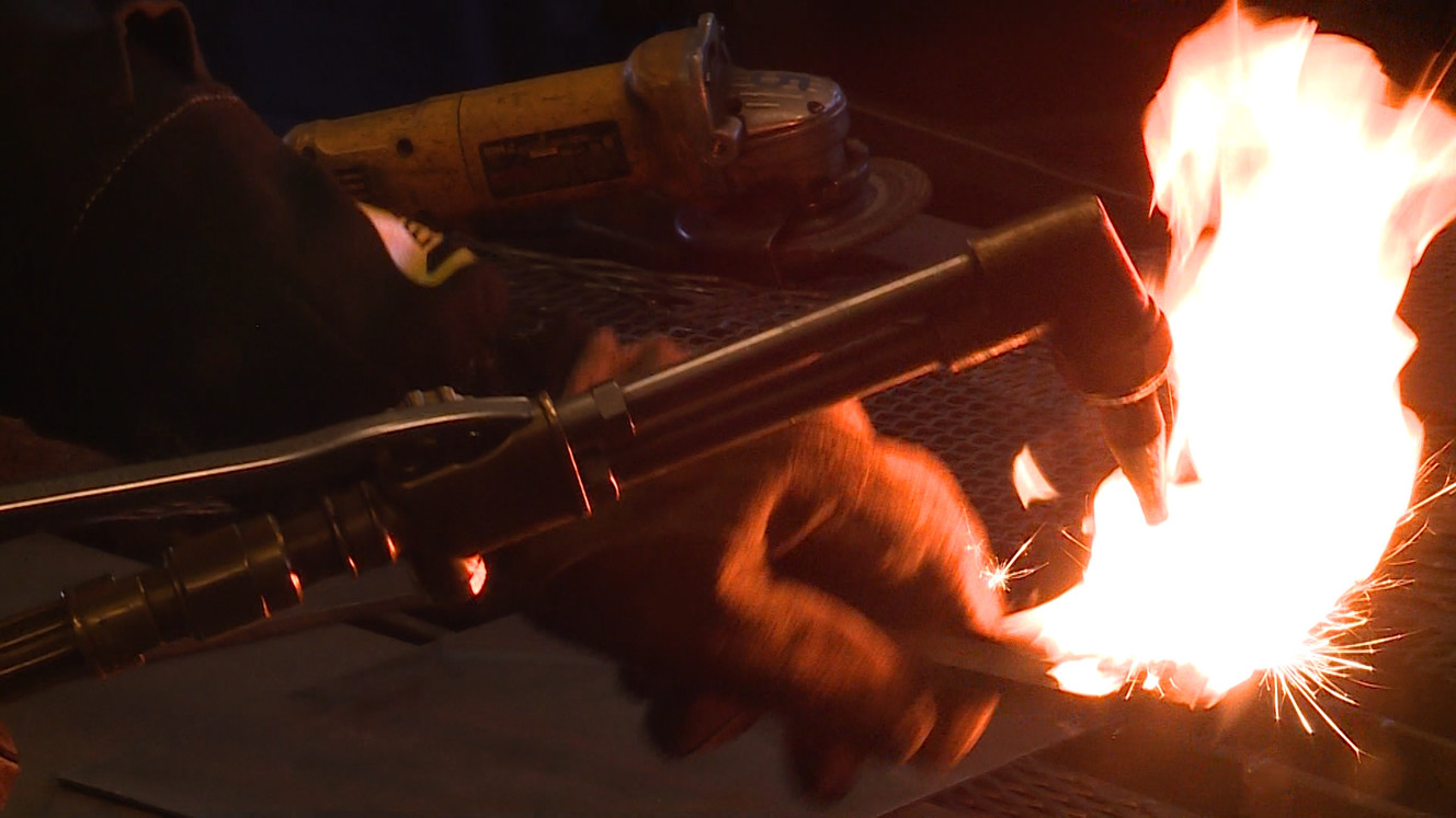 A student lights a torch at Maple Mountain High School in Spanish Fork, Tuesday, March 20, 2018. (Photo: Ray Boone, KSL-TV)
