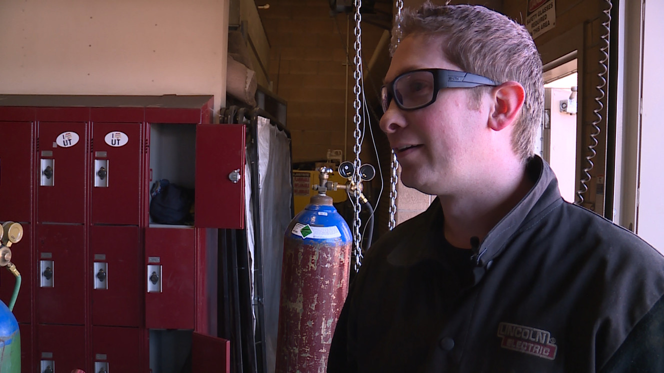 Jared Massic looks around the shop to find a student in need of some pointers, Tuesday, March 20, 2018. (Photo: Ray Boone, KSL-TV)