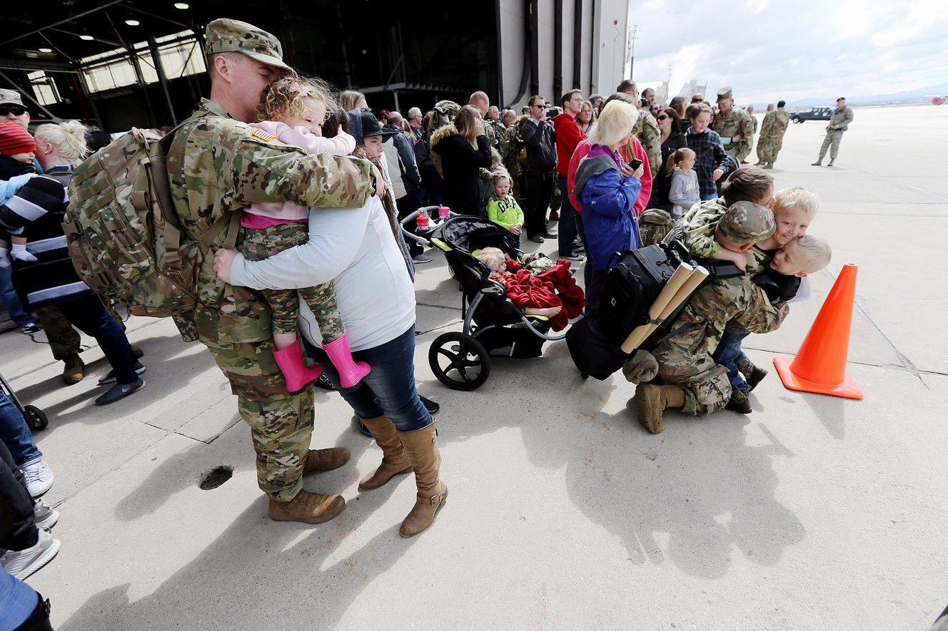 Family and friends say goodbye to their loved ones during a Utah Army National Guard deployment ceremony at Roland R. Wright Air Base in Salt Lake City on Monday, March 26, 2018. The 65th Field Artillery Brigade is deploying to the Middle East in support of Operation Spartan Shield. (Photo: Scott G Winterton, KSL)
