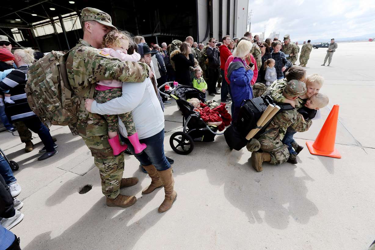 Family and friends say goodbye to their loved ones during a Utah Army National Guard deployment ceremony at Roland R. Wright Air Base in Salt Lake City on Monday, March 26, 2018. The 65th Field Artillery Brigade is deploying to the Middle East in support of Operation Spartan Shield. (Photo: Scott G Winterton, KSL)