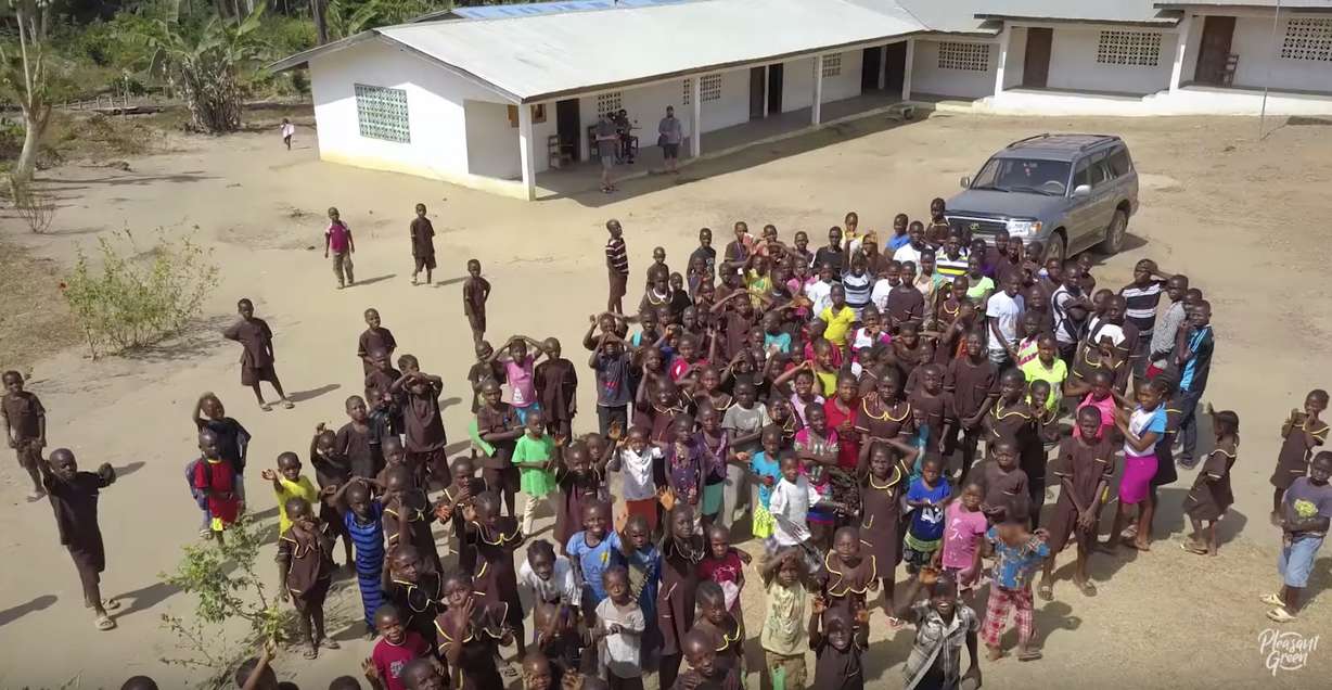 A crowd gathers to greet Utahn Ben Taylor on his first trip to Liberia in February 2018. Together, Taylor and Joel, a Liberian man he met online, have created a charitable organization to raise money to help the impoverished Liberians. (Photo: Courtesy of Pleasant Green YouTube)