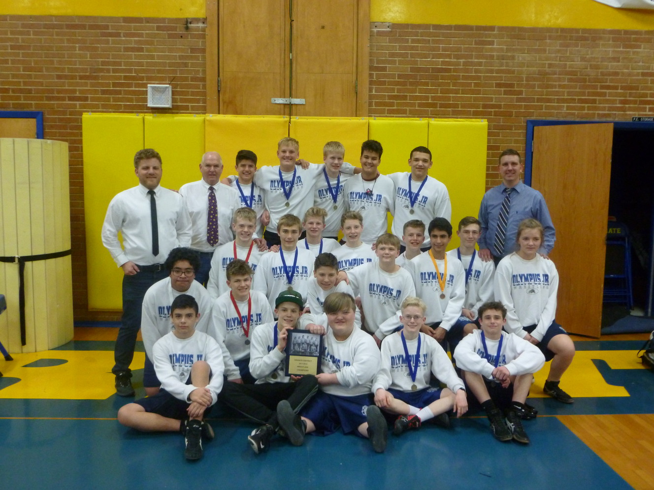 Keeping 20-year streak alive, Olympus Junior High wrestling team again wins district title