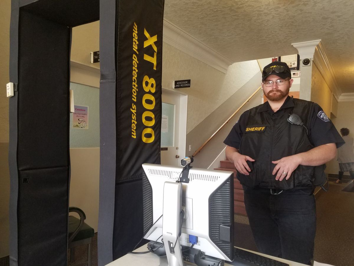 Oneida County reserve sheriff's deputy Katlin Jensen stands next to a metal detector that was moved inside the courthouse in Malad for extra security during a hearing for triple homicide suspect Severo Luera, 39, of Tremonton, Utah. Luera has been charged with three counts of aiding and abetting a murder in the first degree and one count of conspiracy to commit murder in the first degree. (Photo: Shelbie Harris, Idaho State Journal)