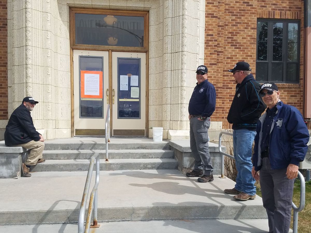 Four deputies with the Oneida County Sheriff's Office stand guard outside the county courthouse for the suppression hearing of Severo Luera, 39, of Tremonton, Utah. Luera has been charged with three counts of aiding and abetting a murder in the first degree and one count of conspiracy to commit murder in the first degree. (Photo: Shelbie Harris, Idaho State Journal)