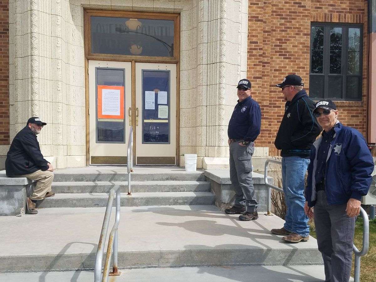 Four deputies with the Oneida County Sheriff's Office stand guard outside the county courthouse for the suppression hearing of Severo Luera, 39, of Tremonton, Utah. Luera has been charged with three counts of aiding and abetting a murder in the first degree and one count of conspiracy to commit murder in the first degree. (Photo: Shelbie Harris, Idaho State Journal)