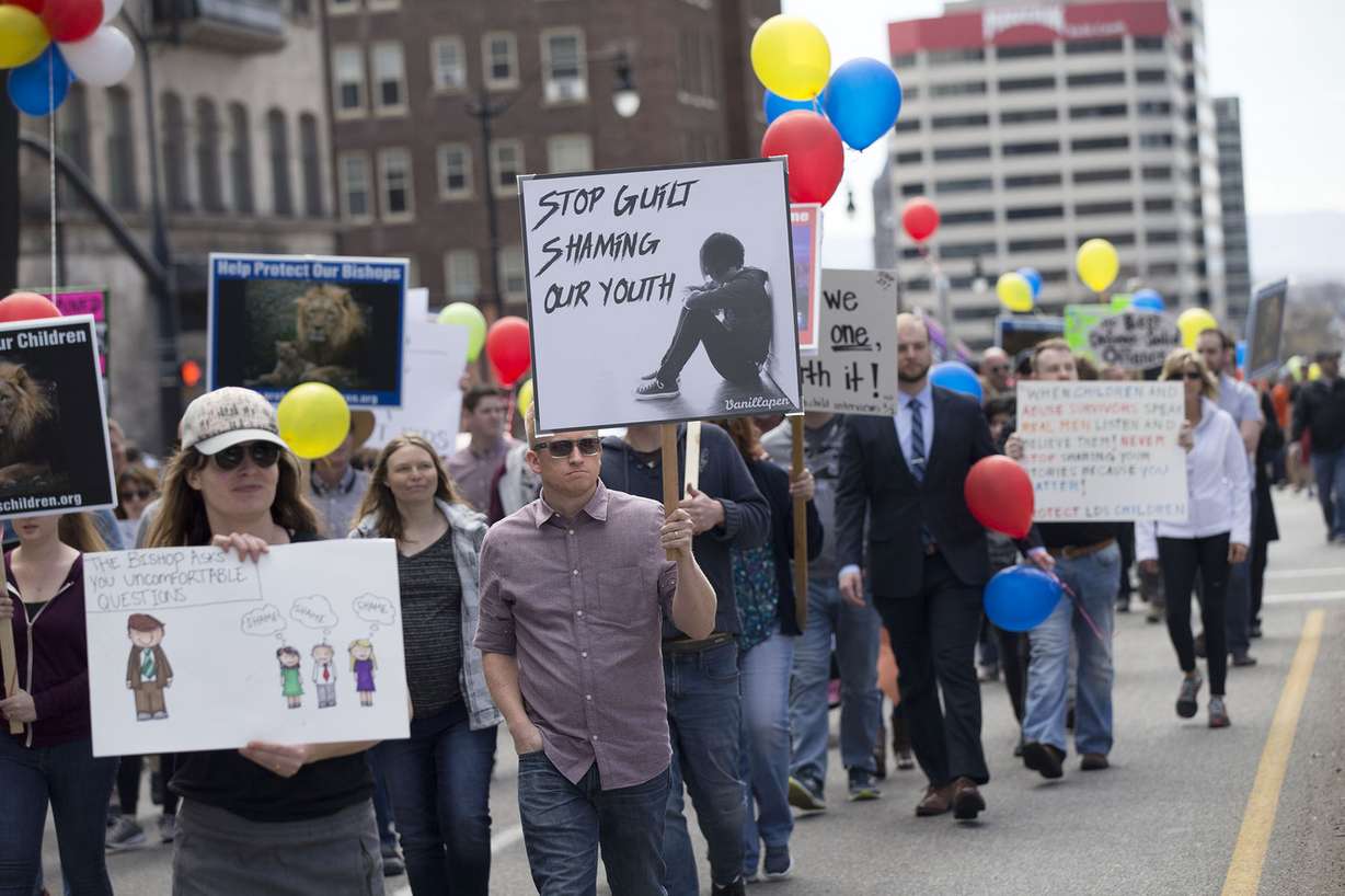 Protesters march to the LDS Church Office Building in Salt Lake City on Friday, March 30, 2018. Attendees at the event, organized by a group called Protect LDS Children, called for further changes to church policies regarding local bishops' interviews of minors. (Photo: Laura Seitz,