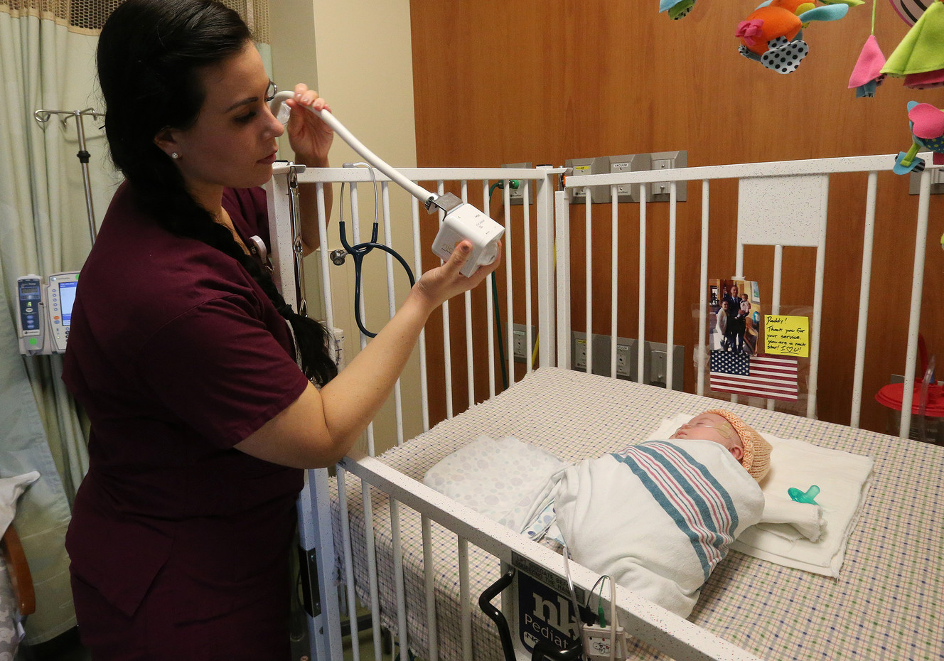 Courtney Tipton, a registered nurse in the neonatal intensive care unit at Timpanogos Regional Hospital in Orem, aims a webcam at newborn John Carter Girtman on Friday, March 23, 2018. John is recovering from pneumonia and new webcam technology allows his deployed father to see live video of him. (Photo: Jeffrey D. Allred, KSL)