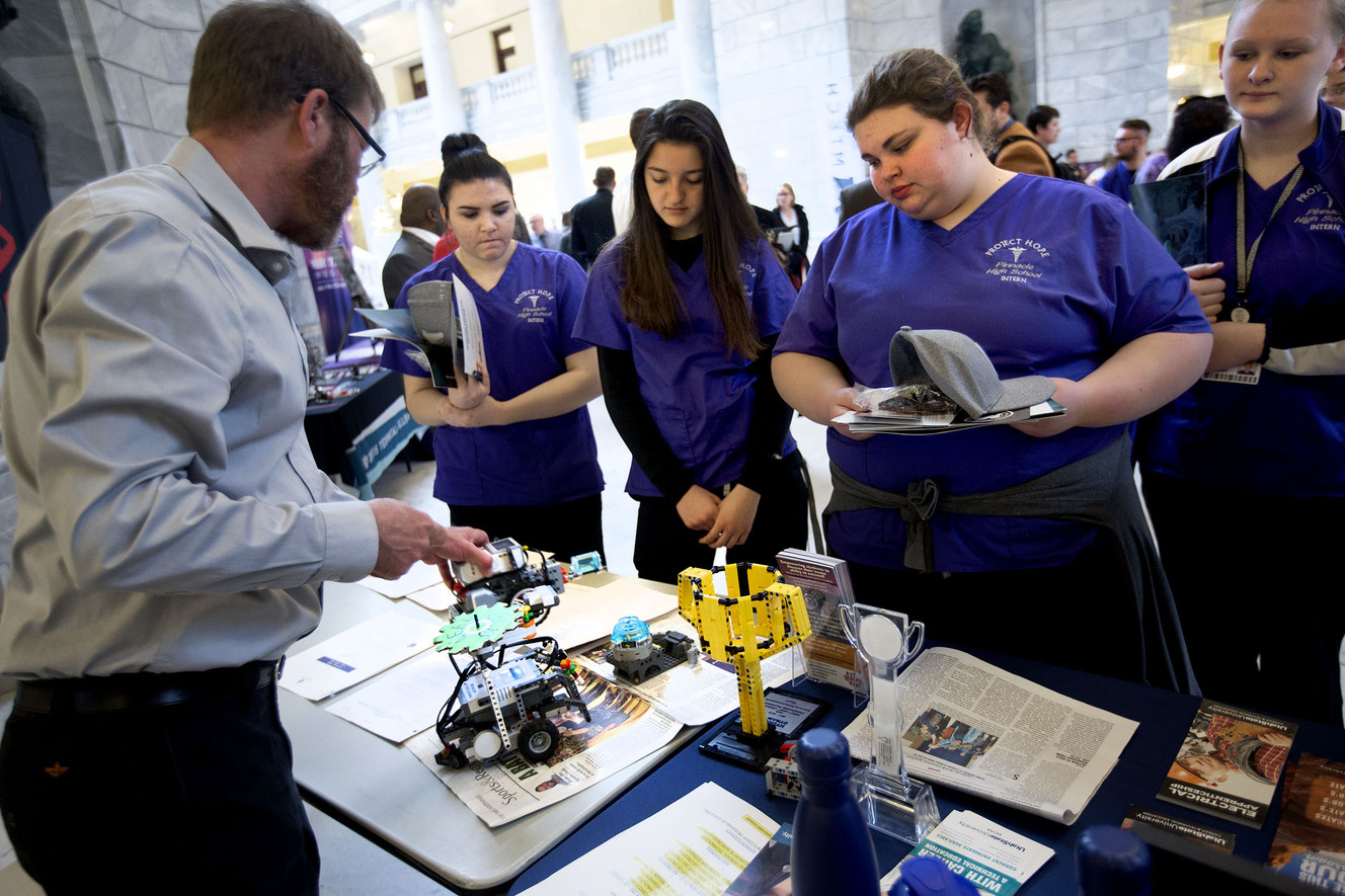 Rob Magleby, STEM coordinator for the BEACON Afterschool Program in Moab, left, talks with Project H.O.P.E. interns Mallory Taylor, left, Hannah Stock, Alyssa Cogswell and Nikkita Cooke about the Lego robotics that his Gear Geeks made during a Talent Ready Utah event at the Capitol in Salt Lake City on Wednesday, March 21, 2018. (Photo: Laura Seitz, KSL)