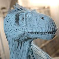 Artists, engineers and scientists collaborate to build colorful sculpture of Utah Raptor