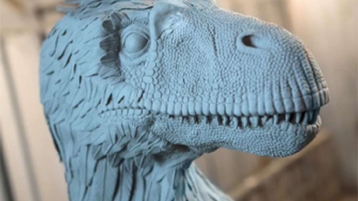 Artists, engineers and scientists collaborate to build colorful sculpture of Utah Raptor