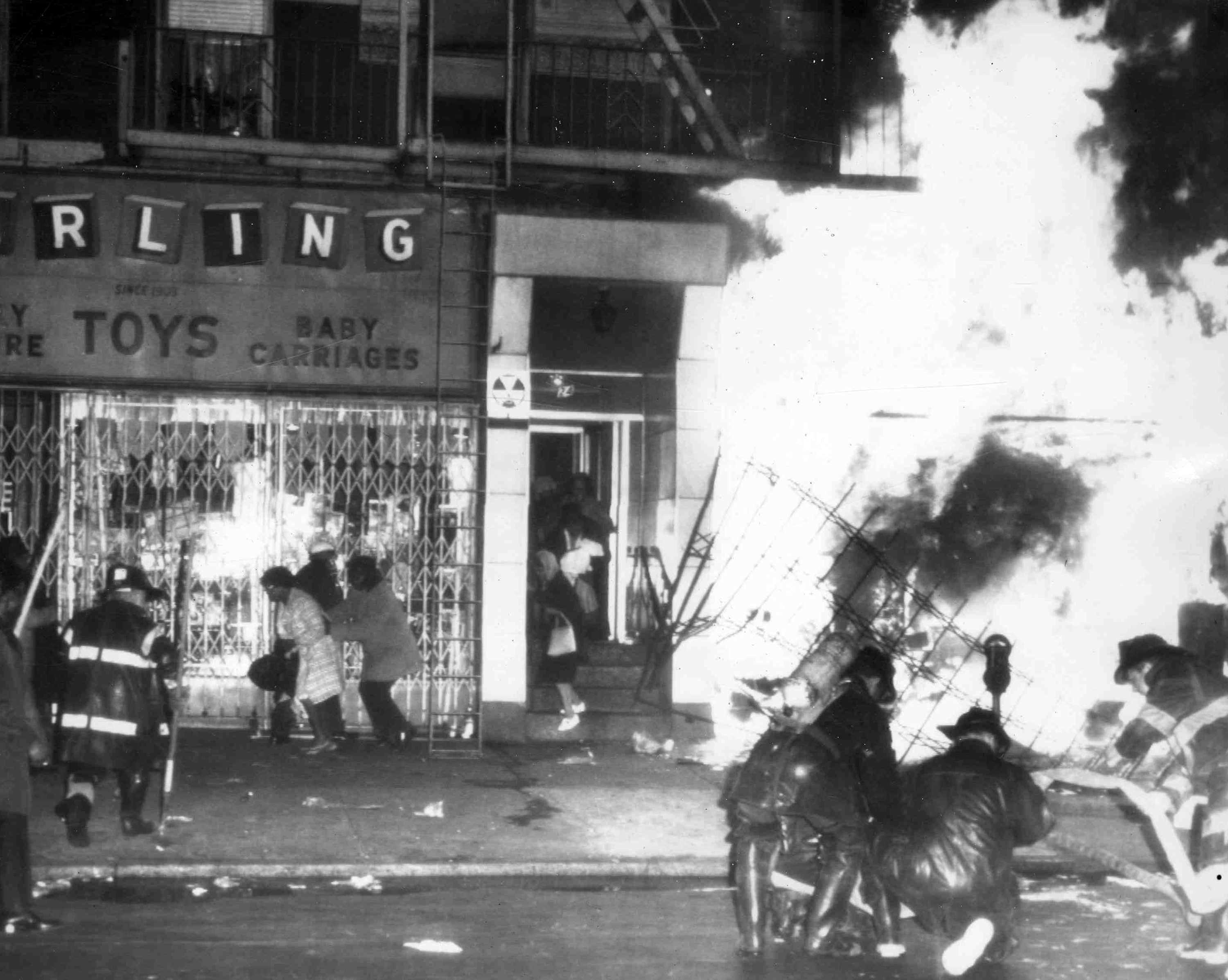 Firemen battle a blaze on 125th Street in Harlem, New York, on April 4, 1968, after a furniture store and other buildings were set on fire after it was learned that civil rights leader Dr. Martin Luther King had been assassinated in Memphis. (AP Photo File)