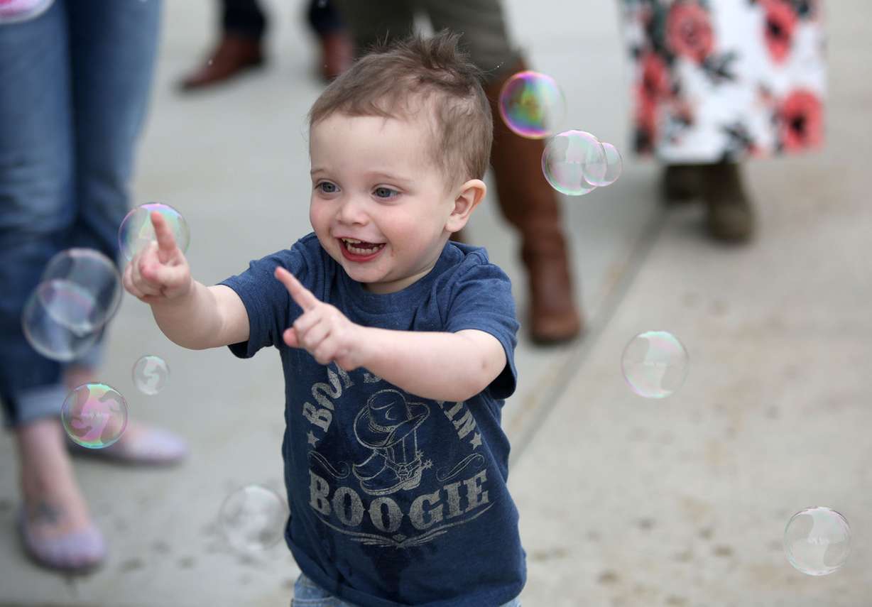 Clark Leneham, who had a liver transplant at age 2, chases bubbles at a Liver Transplant Celebration at Primary Children's Hospital in Salt Lake City on Wednesday, April 4, 2018. (Photo: Kristin Murphy, KSL)
