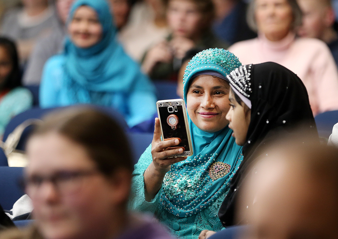 Ahamad Munir smiles as she watches her daughter, Rashidah Munir, speak during the Rohingya Cultural Night in Salt Lake City on Wednesday, April 4, 2018. (Photo: Scott G Winterton, KSL)