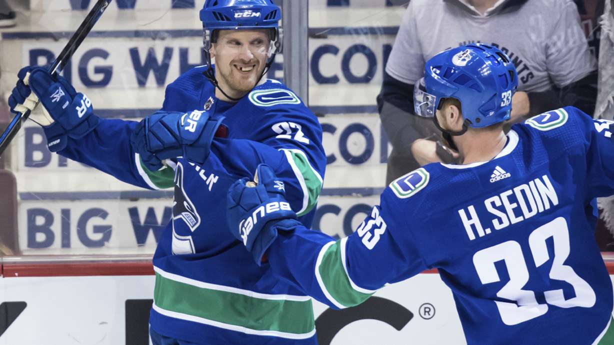 Sedin twins combine on OT winner in their final home game