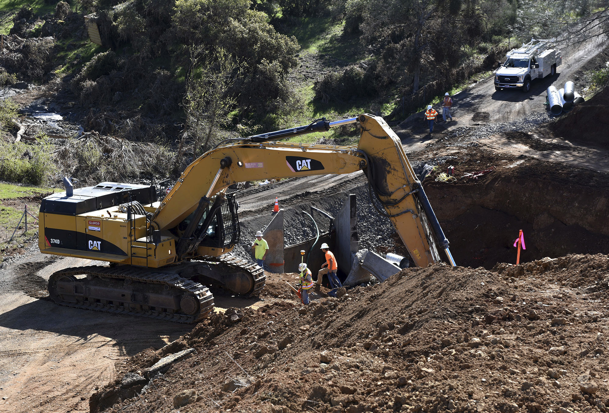 The Latest: California storm cancels planes, ball game