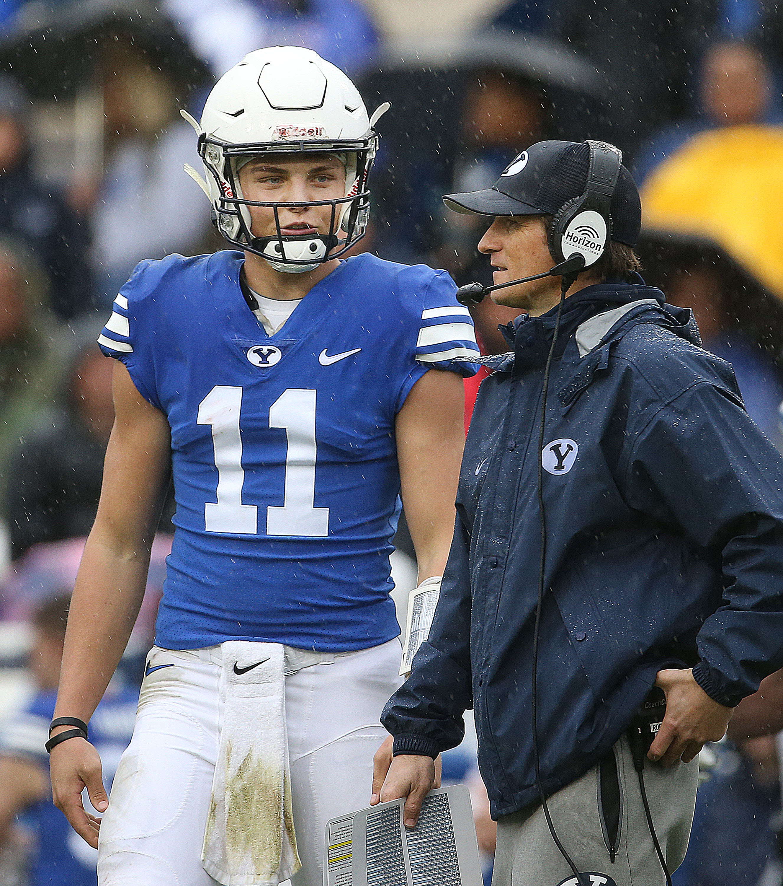 BYU's QB Zach Wilson and QB coach Aaron Roderick confer during the Blue-White game at LaVell Edwards Stadium in Provo on Saturday, April 7, 2018.