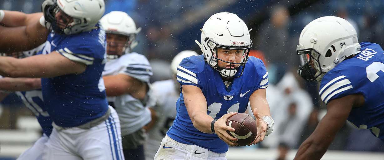 BYU's QB Zach Wilson fakes a handoff to 34 Riley Burt during the Blue-White game at LaVell Edwards Stadium in Provo on Saturday, April 7, 2018. (Photo: Laura Seitz, Deseret News)
