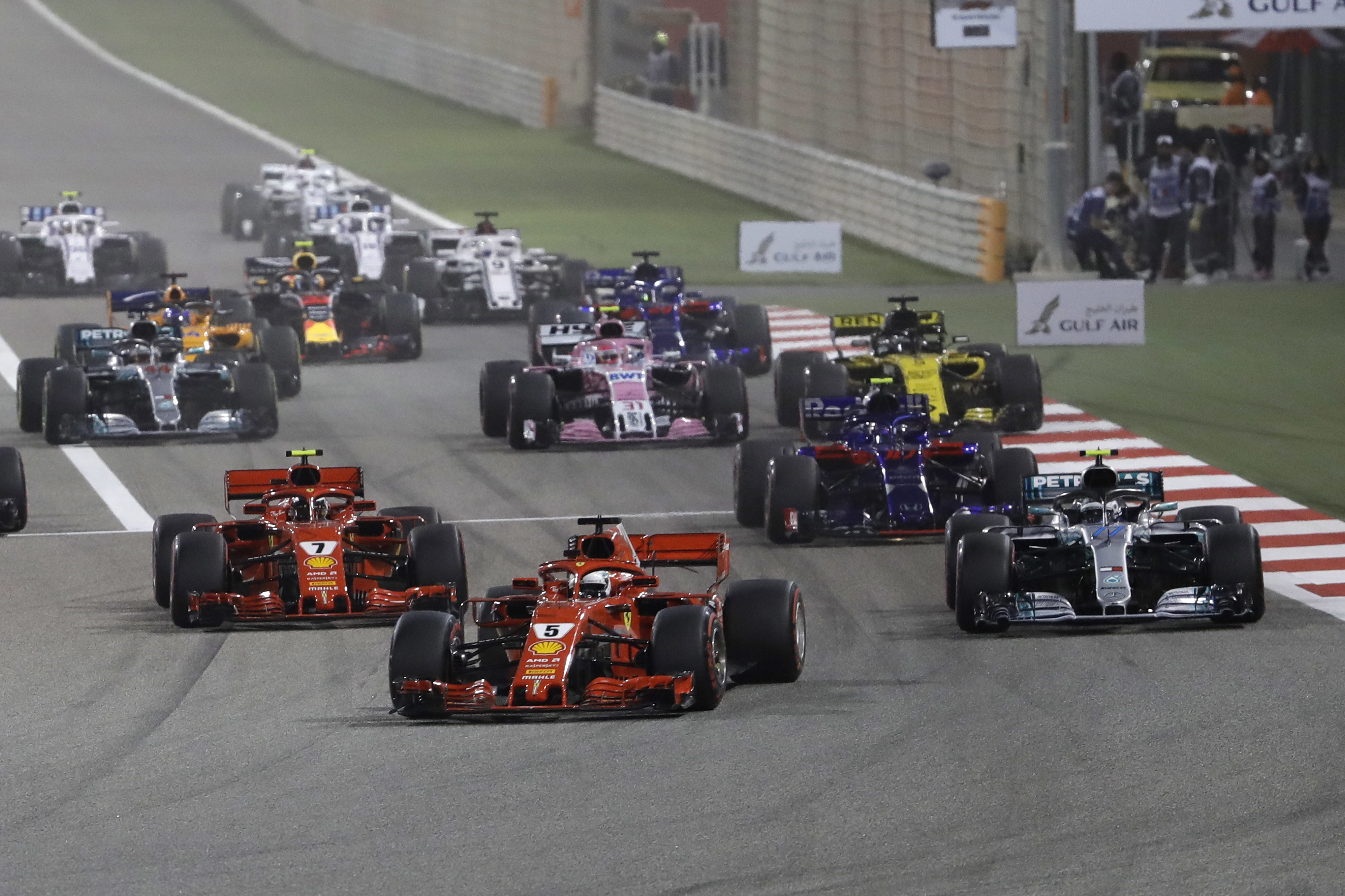 Vettel wins Bahrain, Raikkonen's car breaks mechanic's leg