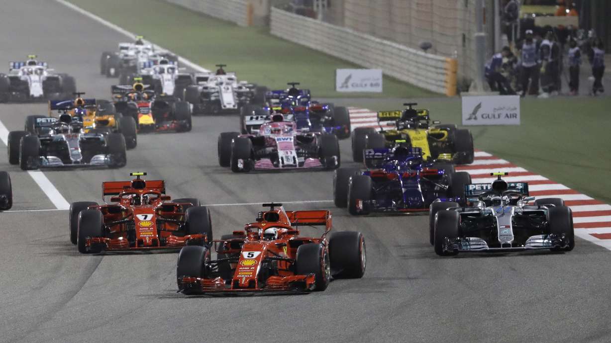 Vettel wins Bahrain, Raikkonen's car breaks mechanic's leg