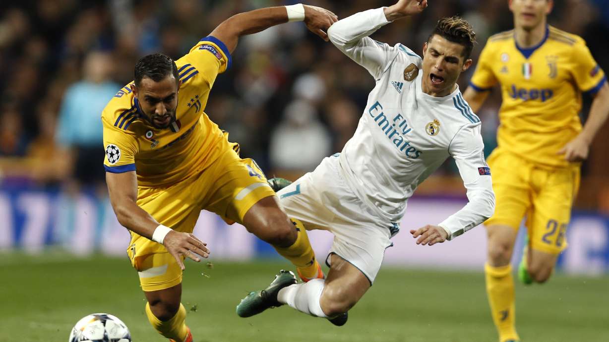 Late Ronaldo penalty keeps Madrid alive in Champions League