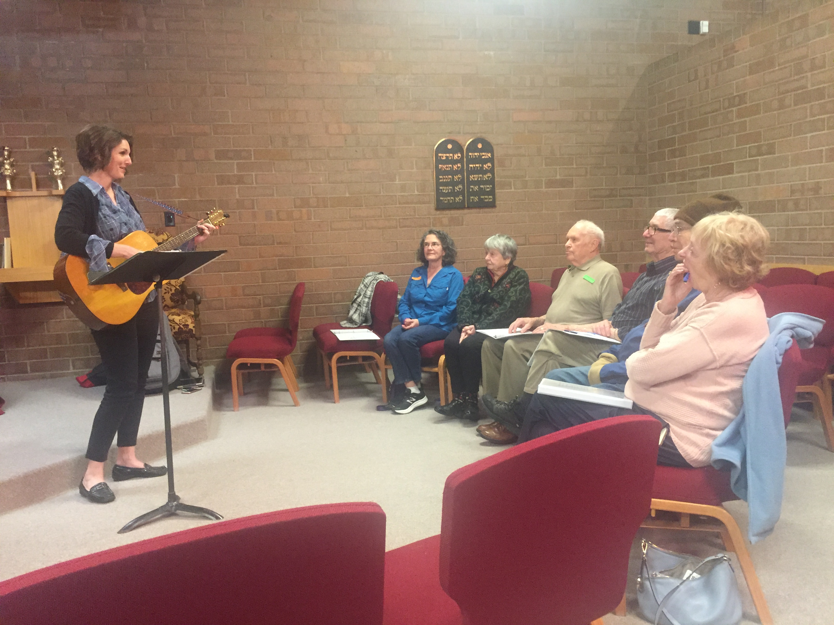 Music therapist Emily Christensen, left, directs practice for a choir made up of dementia patients and their caregivers. Music is stored in a different area of the brain than language and remains intact longer. Photo: KSL TV