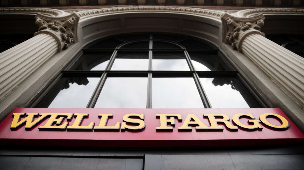 Wells Fargo profit up, faces possible $1 billion settlement