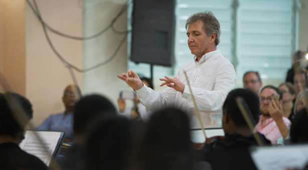 Thierry Fischer, music director of the Utah Symphony, conducts a free concert performed by a 100 Haitian musicians who took part in a five-day workshop from Sunday, March 25 to Friday, March 30, 2018, in Cap-Haitien. Seventeen musicians from the Utah Symphony musicians and several players from the Cleveland Orchestra helped young musicians in Haiti. (Photo: Utah Symphony)
