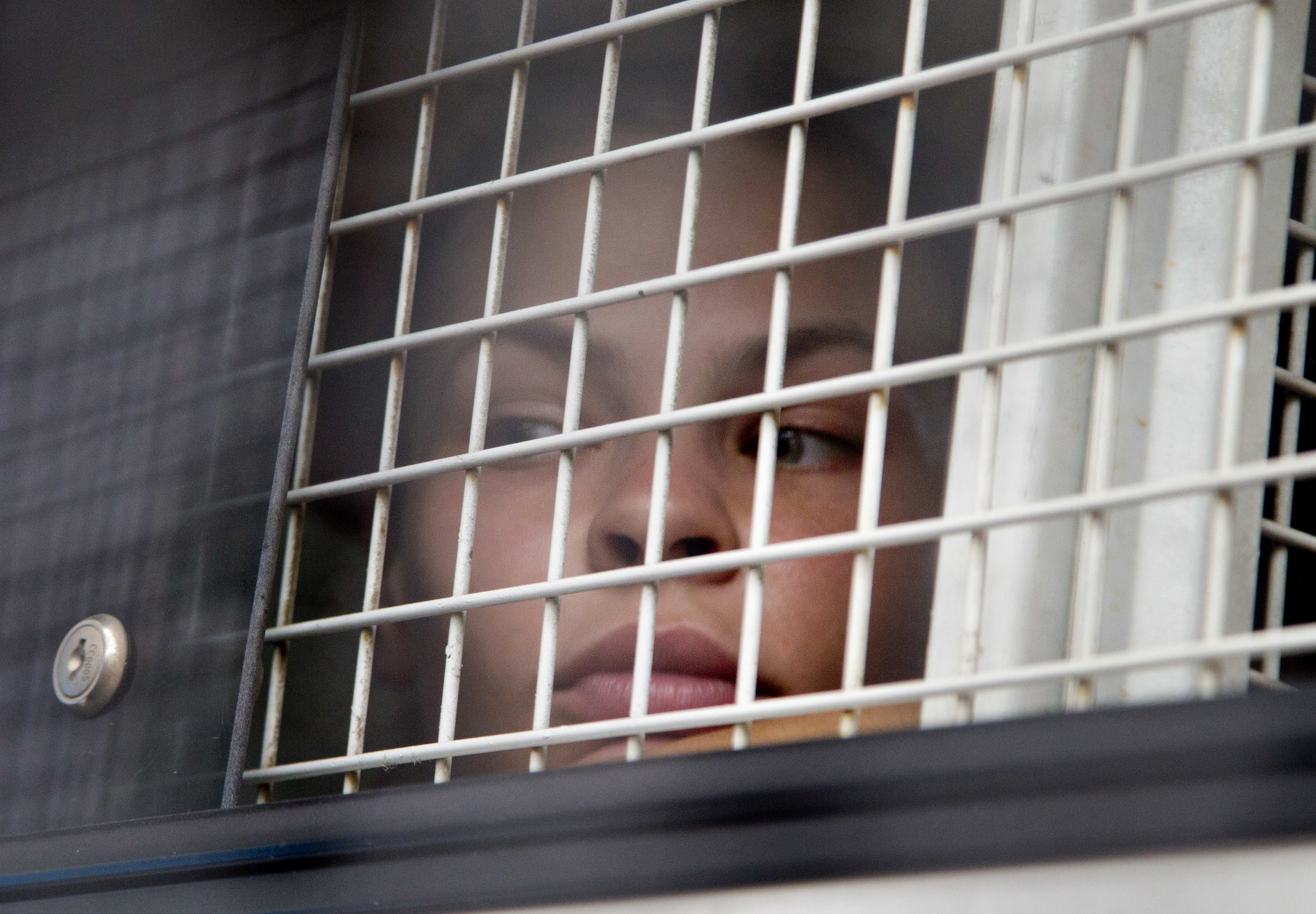 Russian sex guru, follower blame US for continued detention